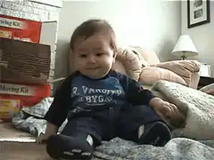 Baby falls over laughing