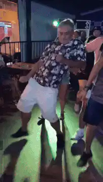 Man dancing in floral shirt