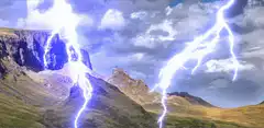 Lightning strikes over mountains