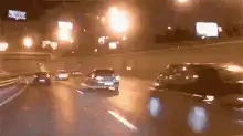 Night highway traffic with bright streetlights