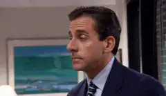 Michael Scott looks around and hides