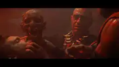 Ghoul King holds skull over prisoner