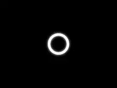 glowing white ring fades to black