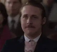 Ryan Gosling smiling and laughing