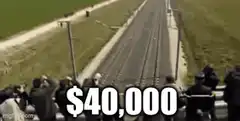 Train passing crowd with $40,000 text