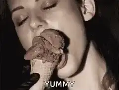 Woman licking chocolate ice cream cone