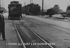 Man lays on train tracks