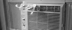 Air conditioner with tape blowing in wind