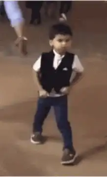 Little boy throws vest and dances