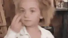 Girl eating and pointing