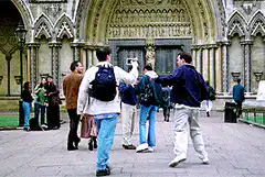 Group of tourists taking photos at a cathedral