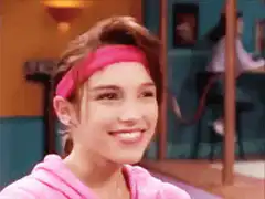 Girl in pink headband smiling