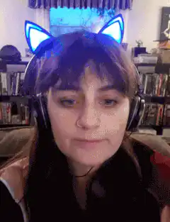 Girl with cat ears makes shocked face
