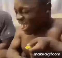 Boy eating lemon makes sour face
