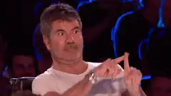 Simon Cowell fingers crossed