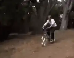 Man riding a swastika bicycle