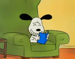 Snoopy laughing while reading a book
