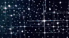 Twinkling stars on a grid background