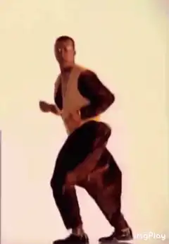Man in yellow vest dancing