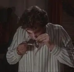 Ray Liotta eating a spoonful of cocaine