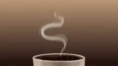 Steam rising from a cup of coffee
