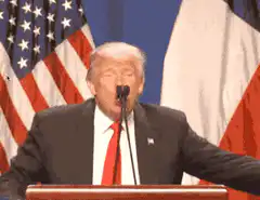 Donald Trump speaking at a podium