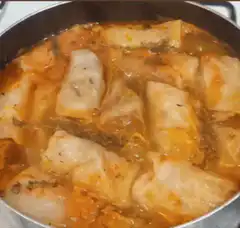 Cabbage rolls simmering in pot