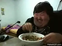 Man eating cereal and laughing