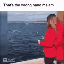 Woman drops phone in ocean