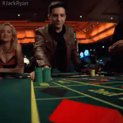 Jack Ryan stacks green chips