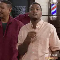Man in barber chair looks confused