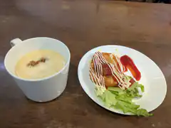 soup and fried cutlet on table
