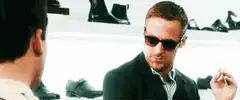 Ryan Gosling smoking in a shoe store
