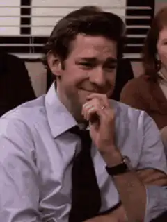 Jim Halpert laughing and covering his mouth