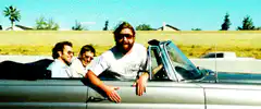 Three men in a convertible car