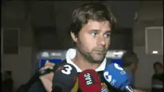 Man looking confused at microphones