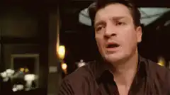Nathan Fillion pointing and facepalming