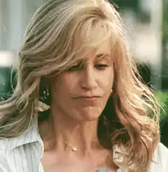 Woman removes her blonde wig