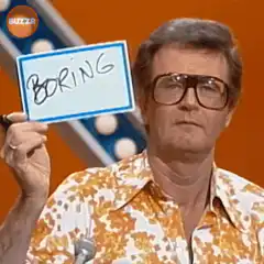 Bob Barker holds up a Boring sign