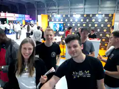 Group of people posing at a tech conference