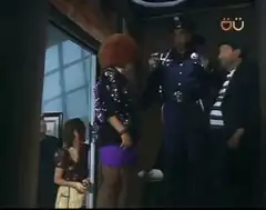 Police officer waves goodbye to woman