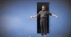 Man bowing in front of a door