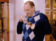 Man drinking from a bottle with a straw