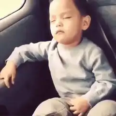 Toddler wakes up and starts dancing in car