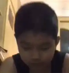 Boy looks up with a blank stare