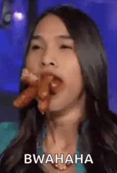 Woman eating pretzel laughing