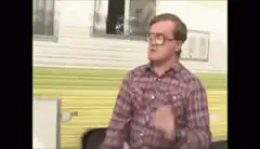 Man in plaid shirt dancing with a crowbar