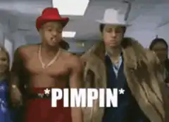 Two men pimpin down a hallway