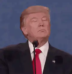 Donald Trump spits out water