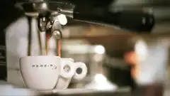 espresso pouring into white cup